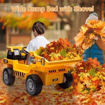 Bright yellow toy dump truck filled with autumn leaves in fall outdoor setting, playful kids enjoying outdoor activities, ideal for children's toys and outdoor play products.