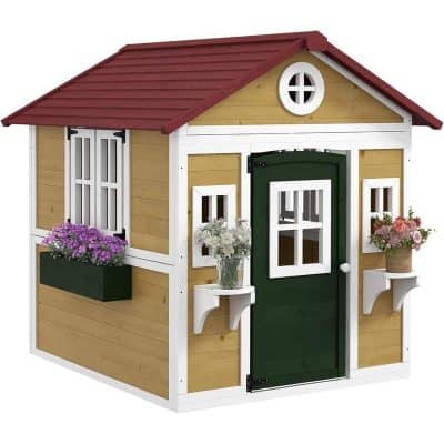 Garden playhouse with window boxes, green door, and flower planters, ideal for children's outdoor play and garden decor.
