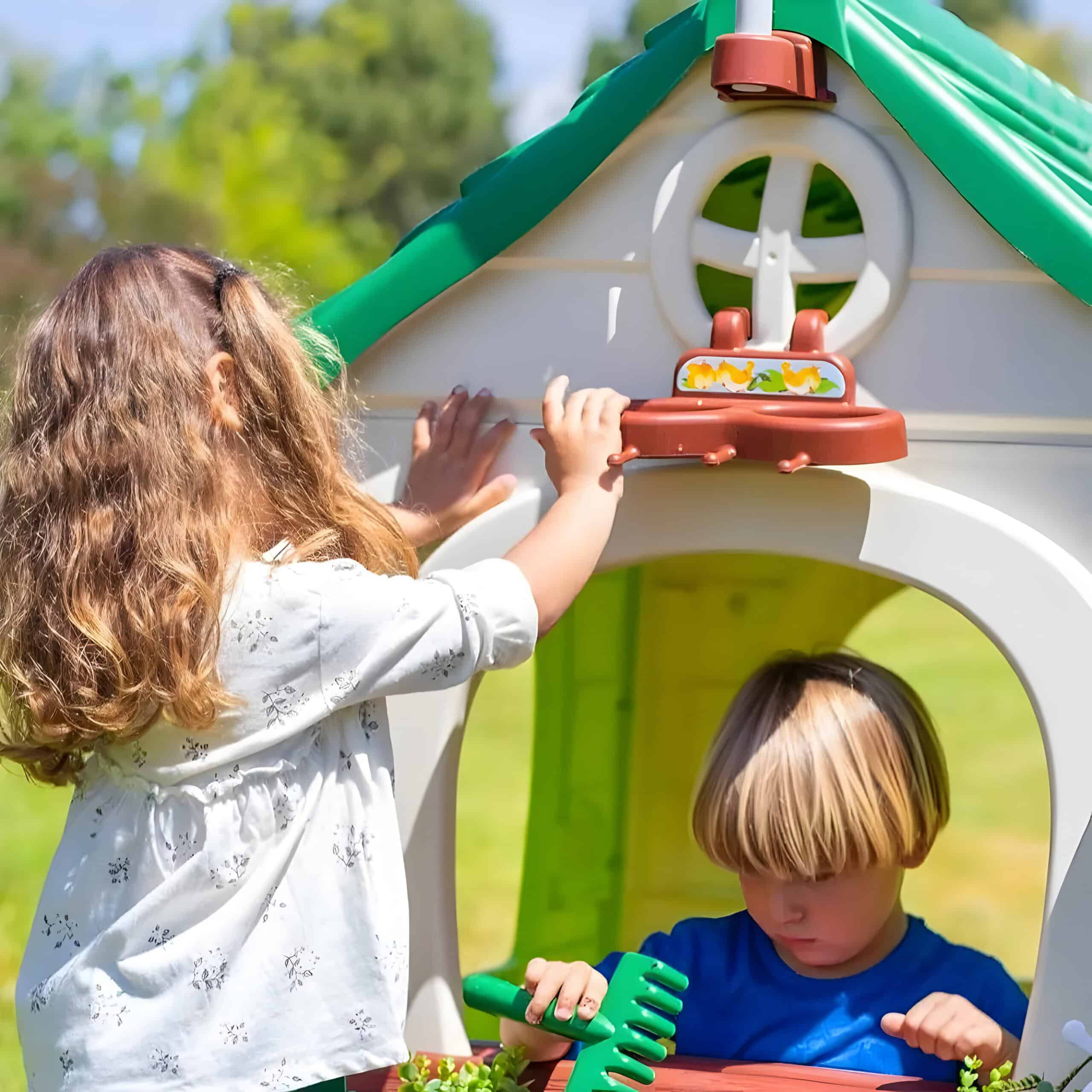 Colorful children's playhouse with a girl and boy playing outdoors, promoting fun, imaginative play, and outdoor activities for kids.