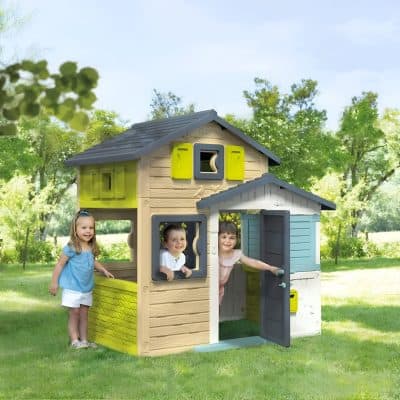 Colorful kids playhouse with windows and door on a green lawn, ideal for children's outdoor activities and imaginative play. Perfect for a backyard, offering a fun, safe space for kids to enjoy outdoor games.