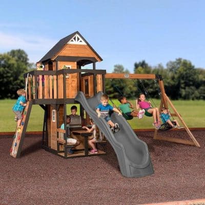 Children playing on a wooden outdoor playground set with slides, swings, and a playhouse, designed for kids' recreation at Monalisa Store.