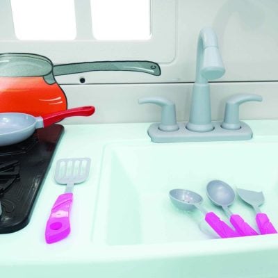 Colorful children's toy kitchen with utensils and cookware, designed for imaginative play and early childhood learning. Bright, engaging, and safe for young kids.