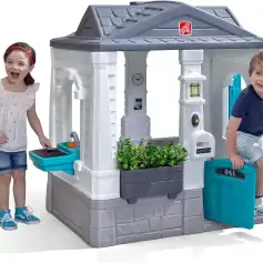 Cute kids playing with toy house in backyard, kids pretending to cook and explore, children's outdoor playhouse with realistic details, perfect for imaginative play, colorful and durable plastic playhouse for children from Monalisa Store.