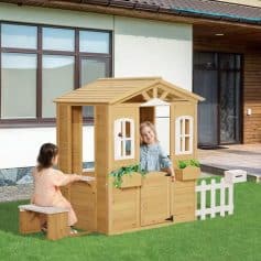 Wooden playhouse for kids, outdoor children’s playhouse with garden features, Monalisa Store children's outdoor wooden playhouse with windows, bench, and white picket fence for backyard fun, perfect for imaginative play.
