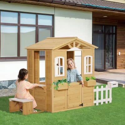 Wooden playhouse for kids, outdoor children’s playhouse with garden features, Monalisa Store children's outdoor wooden playhouse with windows, bench, and white picket fence for backyard fun, perfect for imaginative play.
