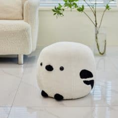 Soft plush panda-shaped ottoman, modern home decor accent, adorable animal-themed furniture for living room or kids' space.