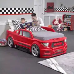 Red race car bedroom bed for kids, perfect for a children's bedroom with fun car-themed decor and toys. Ideal for young children who love vehicles and imaginative play.