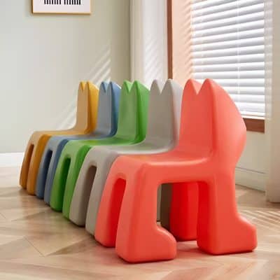 Colorful children's plastic chairs at Monalisa Store for optical accessories and kids' eyewear.