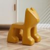 Yellow children's chair with a playful animal shape, ideal for kids' spaces, modern and colorful decor for a fun, inviting environment.