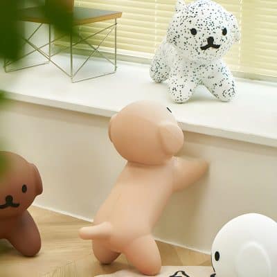 Cute plush dog toys on display at Monalisa Store with modern home decor, perfect for children's rooms or gift shopping.