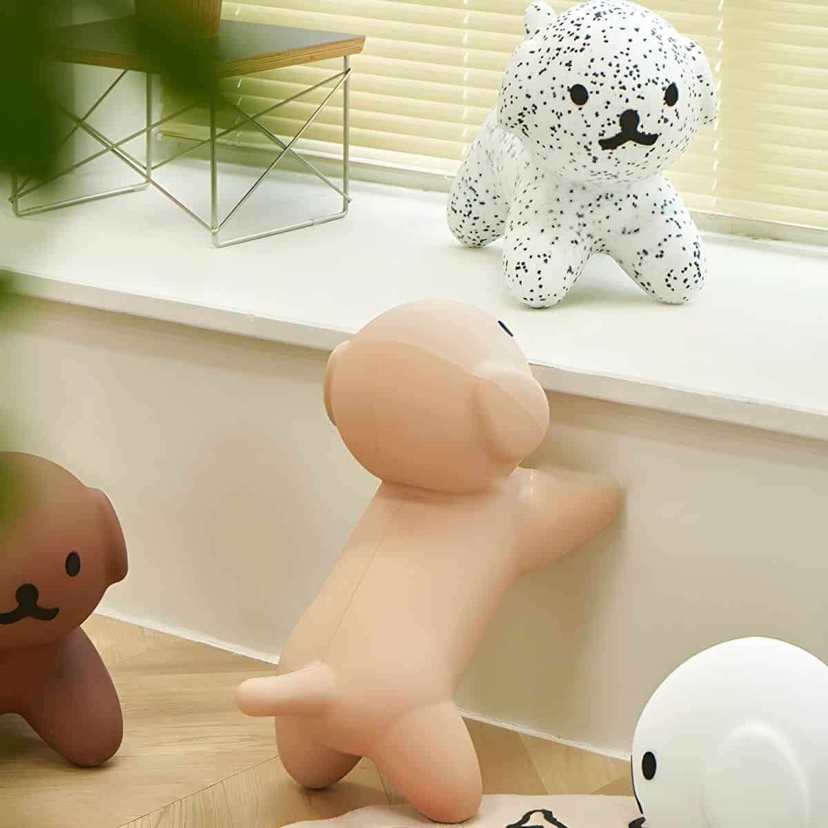Cute plush dog toys on display at Monalisa Store with modern home decor, perfect for children's rooms or gift shopping.