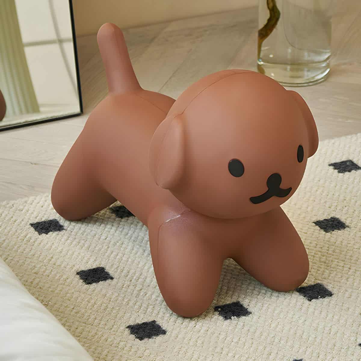 Soft pink dog-shaped storage container or decorative item, designed for home organization or playful decor, with cute facial features and a rounded body. Perfect for adding a touch of fun to any space.