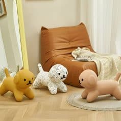 Soft plush dog and cat-shaped toys with modern decor in a cozy, stylish room at Monalisa Medical Store.