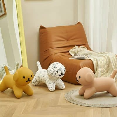 Soft plush dog and cat-shaped toys with modern decor in a cozy, stylish room at Monalisa Medical Store.