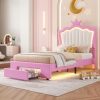 Pink children's bed with illuminated crown headboard, romantic nursery decor, soft pastel tones, playful design, ideal for a cozy Kids' bedroom, featuring storage drawer and plush cushions.