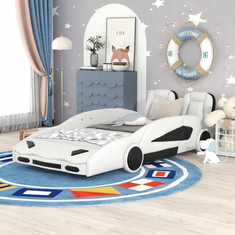 Modern car-shaped kids bed in a playful nursery decorated with stars and a life buoy wall decor, perfect for a child's bedroom or play area.