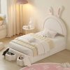 Cute bunny-themed kids bedroom with white furniture, plush toys, and whimsical decor, perfect for a cozy, playful space for children.