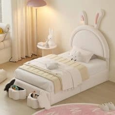 Cute bunny-themed kids bedroom with white furniture, plush toys, and whimsical decor, perfect for a cozy, playful space for children.