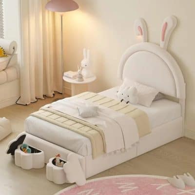 Cute bunny-themed kids bedroom with white furniture, plush toys, and whimsical decor, perfect for a cozy, playful space for children.