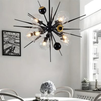 Contemporary black and gold sputnik chandelier with exposed bulbs, modern interior lighting fixture for stylish living rooms.