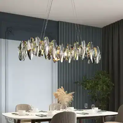 Elegant modern chandelier with crystal accents in a stylish dining area. Perfect for adding luxury and ambiance to upscale interior spaces.