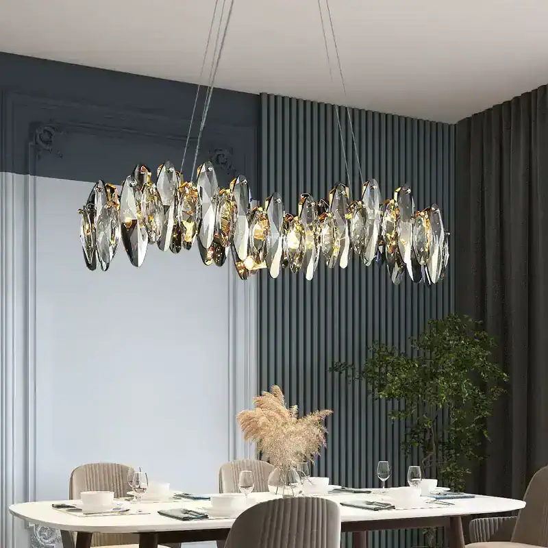 Elegant modern chandelier with crystal accents in a stylish dining area. Perfect for adding luxury and ambiance to upscale interior spaces.