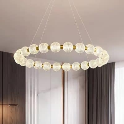 Luxurious modern pendant chandelier with textured glass orbs and gold accents, perfect for stylish living room or dining area decor.