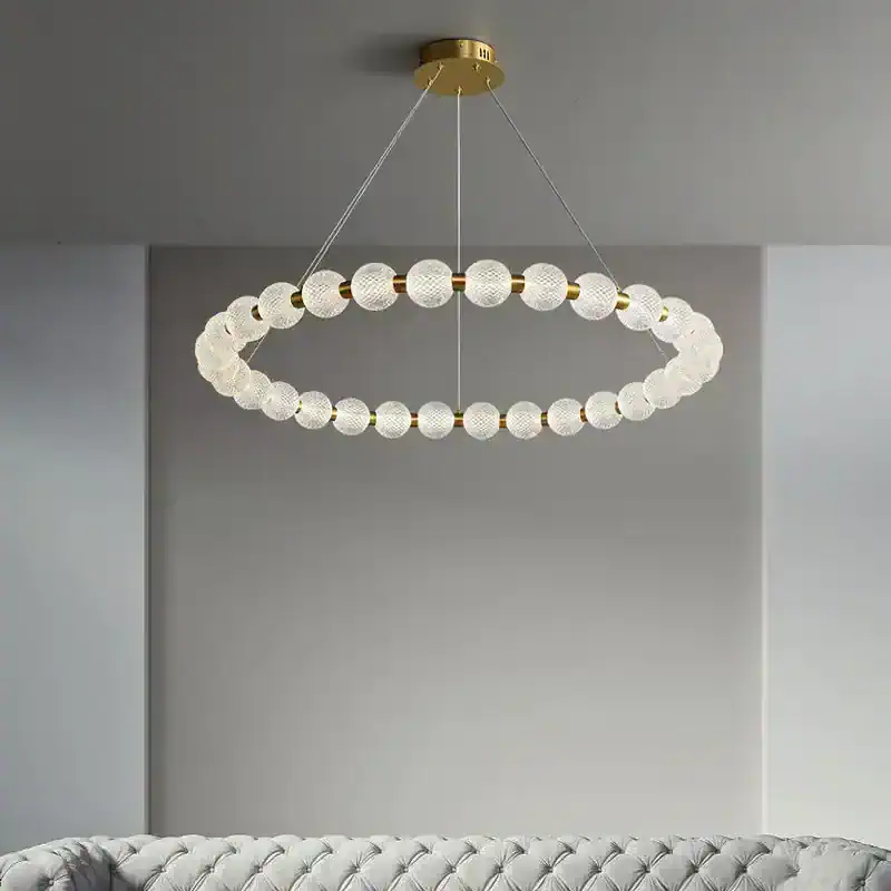 Elegant modern chandelier with glass globe accents, ideal for upscale living rooms and dining areas, enhancing contemporary interior decor.