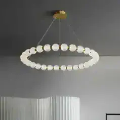 Elegant modern chandelier with crystal glass globes and gold accents, ideal for luxury interior lighting.
