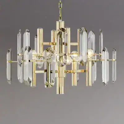 Elegant crystal chandelier with gold accents suitable for luxury interior decor and upscale lighting solutions for homes and commercial spaces.