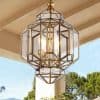 Modern geometric outdoor chandelier with gold accents, perfect for enhancing patio and garden lighting.