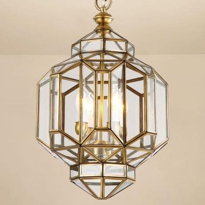 Elegant brass and glass pendant chandelier with multiple candle-style lights, ideal for luxury home or hotel decor.