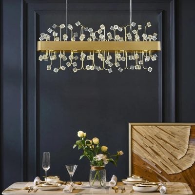 Elegant modern chandelier with gold accents and cube-shaped glass details for luxury interior lighting. Perfect for upscale dining rooms, living spaces, or sophisticated home decor.