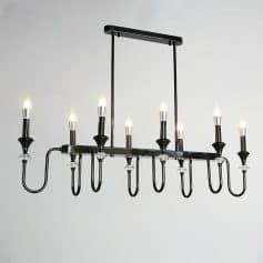 Black modern chandelier with multiple candle-style lights, ideal for stylish home or office decor, available at Monalisa Store for elegant lighting solutions.