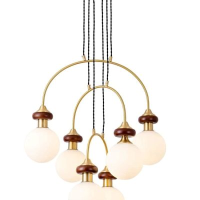 Modern gold and wooden chandelier with frosted glass globes, perfect for upscale interior decor and lighting solutions.