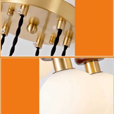 Gold and black modern chandelier with spherical light globes and crystal accents, perfect for elegant interior lighting decor, Monalisa Store opt lighting fixtures, luxury lighting design.