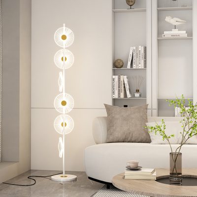 Floor lamp with modern geometric design in a stylish living room, adding ambient lighting and contemporary decor. Perfect for creating a cozy and elegant atmosphere in your home.