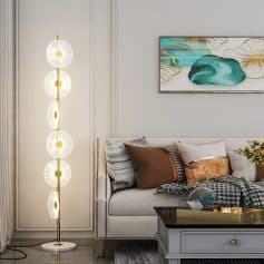 Floor lamp with modern floral design, white and gold decorative lighting for living room decor.