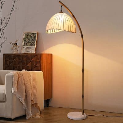 Floor lamp with beige lampshade and marble base, modern living room lighting, stylish interior decor for home or office.