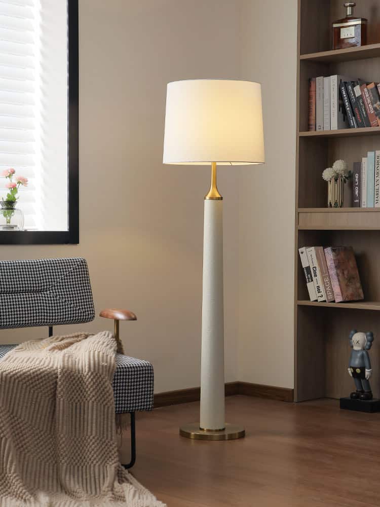 Elegant modern floor lamp with a white and gold finish, ideal for living rooms or reading corners, enhancing home decor with stylish lighting.
