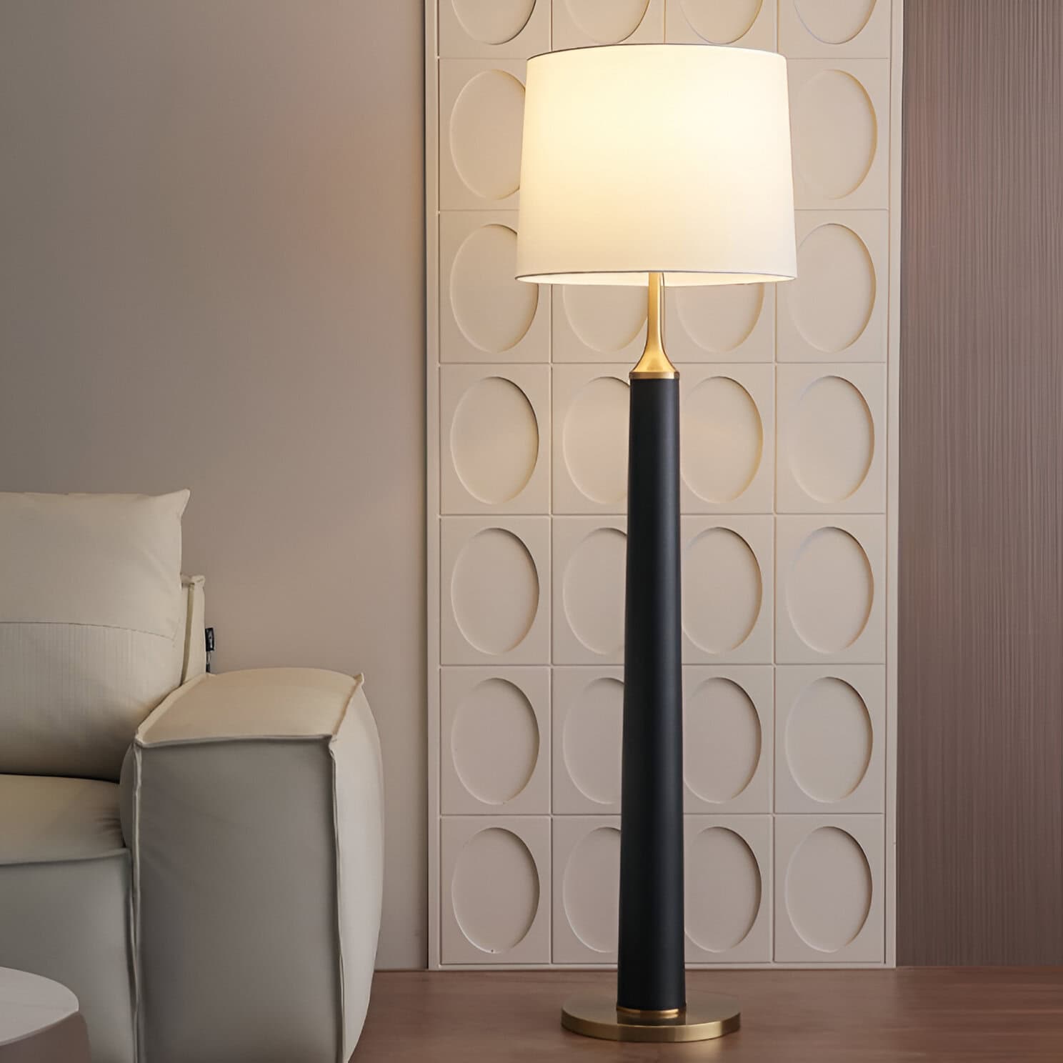 Elegant modern floor lamp with a black and gold finish, perfect for living rooms or bedrooms, enhancing interior decor and lighting ambiance.
