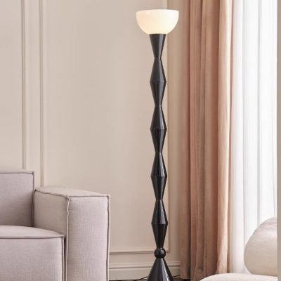 Elegant black and white floor lamp in a modern living room, perfect for stylish interior illumination.