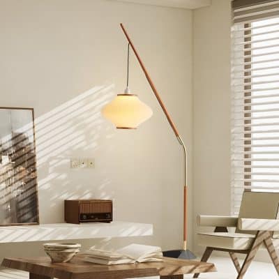 Sleek modern floor lamp with adjustable stand in a contemporary living room setting, emphasizing stylish interior lighting solutions.