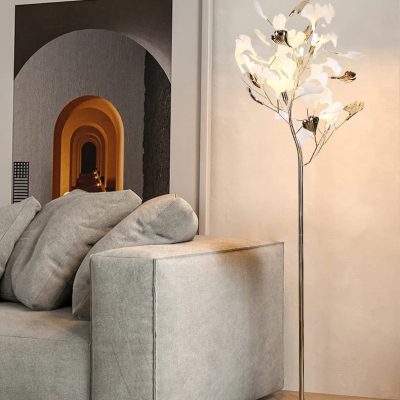 Flush mount floor lamp with artistic flower design in a modern living room, featuring neutral tones, a comfortable sofa, and stylish decor. Perfect for elegant home lighting.
