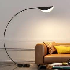 Modern black arc floor lamp with LED light in stylish living room.