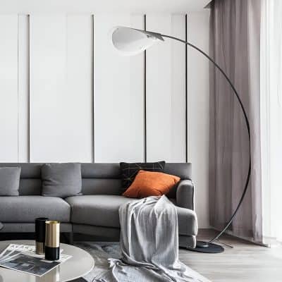Modern living room with stylish gray sofa, contemporary floor lamp, and elegant decor, perfect for showcasing comfortable home interior design and furniture options from Monalisa Store.
