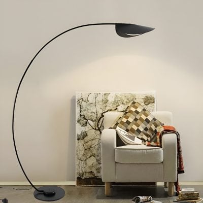 Modern floor lamp with curved black arm and sleek shade in stylish interior setting, perfect for reading or living room decor.