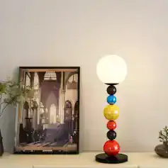 Vivid modern table lamp with multicolored spherical base and white globe shade, stylish home decor for living room or bedroom, showcased at Monalisa Store.