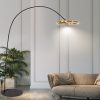 Elegant modern indoor lamp with a curved black stand and gold accent, ideal for stylish living room decor and ambient lighting. Perfect for contemporary home interior design.