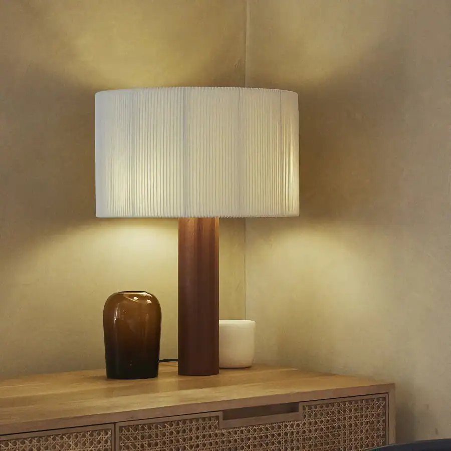 Soft beige table lamp with a textured fabric shade, perfect for modern interior decor and enhancing the ambiance in ophthalmology clinics or optometry offices.
